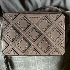 Michael Kors grommet cross body bag. Super cute, taupe color, great condition!